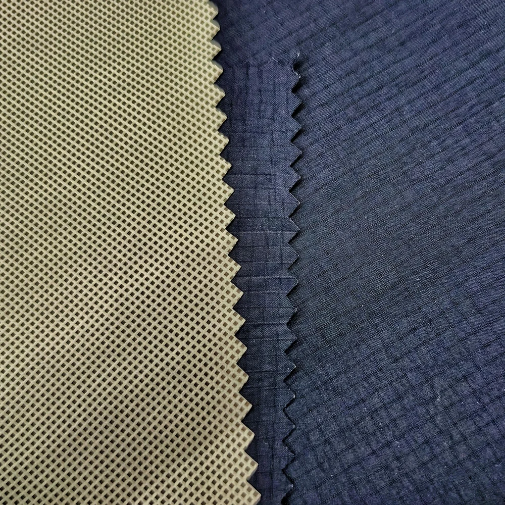 Folded sample of 40D nylon ripstop fabric showing smooth drape and lightweight feel